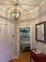 Entrance hallway with mirror and credenza