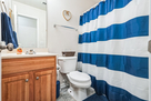 Secondary bathroom with shower and tub.