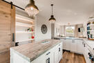 Kitchen center island and pantry with lightin