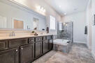 Master Bath with tub and shower and closet.