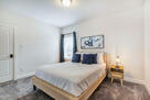 One of 3 queen bedrooms.