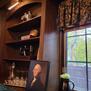 Bookshelf with books and antiques.