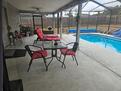 Covered Patio with lights and inground pool