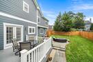 Backyard includes deck and white cedar fence