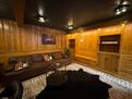 Finished Basement with large TV and Poker set