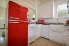 Kitchen with retro fridge, stove, dishwasher