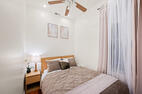 Queen bedroom with natural light