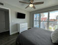 Room darkening shades, queen bed, TV