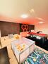 pool table and play kinds area with full bed
