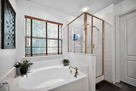 Main bedroom bath with walk-in shower and bat
