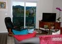 Living room and TV area.  South-facing Flatir