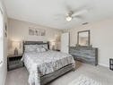 Furnished Guest Bedroom with Ceiling Fan