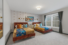 Two full sized beds with fun decor