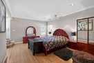 The upper level primary bedroom has a private