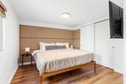 Clean comfortable bedroom with natural light