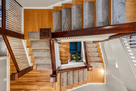 Wider view from loft stairs down 2 flights to