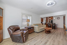Family rm adjoins kitchen.