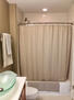 Ceramic tiled bathroom with glass basin sink