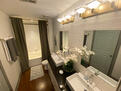 Double sink with ceramic tiled wall