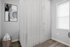 Full bathroom with tub and shower curtain