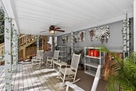 Relax & Rock away under the open covered deck