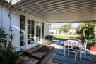 Beautiful back patio with a BBQ