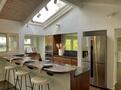 Nice chef&rsquo;s kitchen featuring a skylight