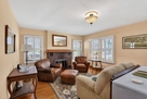 Bright and cozy living room  includes gas fir