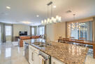 View from gourmet kitchen and to living room.