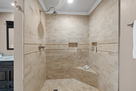 Primary  Bathroom walk in shower with tumbled