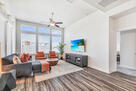 Living room with seating for 5.