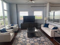Living room 10 ft ceiling and large windows