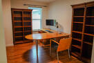 Dedicated office space with desk and monitors