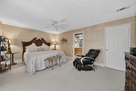 Master bedroom with included massage chair