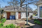 Garage & shed w/ garbage & recycling bins