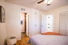 Master bedroom with a queen size bed