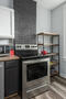 Kitchen stocked with cookware and utensils