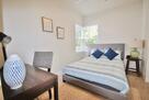 Bedroom 2 with a queen sized bed and desk