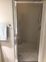 Large tiled shower with bench