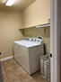 Laundry room full sized ironing board/iron/cl