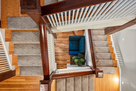 View from loft stairs down 2 flights to foyer