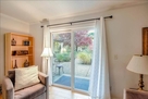 Living room with sliding glass doors out to p