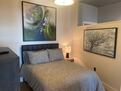 Bedroom 2 with beautiful artwork