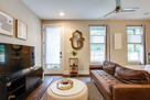 Bright living room with comfy seating and a s