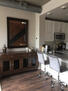 Credenza with over sized mirror in living roo
