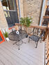 Second-floor rear porch with bistro seating