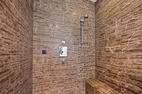 Walk-in shower with bench and handheld shower