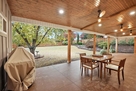Covered Patio with BBQ Grill and Seating Area
