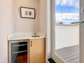 Mini fridge by rooftop deck for entertaining