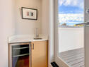 Mini fridge by rooftop deck for entertaining